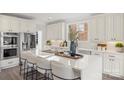 Modern kitchen with stainless steel appliances, white countertops, and a spacious island at 4012 Cambridge Hill Ln, Charlotte, NC 28270