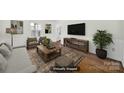 This staged living room provides furniture ideas and layout of this space, creating a comfortable ambiance at 4601 Crooked Oak Ln, Charlotte, NC 28226