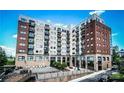 Modern exterior elevation of condo building with balconies at 715 N Church St # 301, Charlotte, NC 28202
