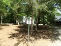 A large lot with mature trees surrounds this home with a detached garage at 7218 Alexander Farm Rd, Monroe, NC 28110