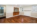 Inviting living room with hardwood floors, decorative wood accent, and ample natural light at 813 North Ave, Charlotte, NC 28208