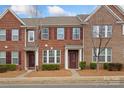 Attractive brick townhome with well-manicured landscaping and classic architectural details at 9017 Lanark Ln, Fort Mill, SC 29707