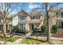 Charming two-story home featuring a welcoming front porch and beautifully landscaped front yard at 9113 Cinder Ln, Huntersville, NC 28078