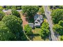 Stunning aerial view of a home surrounded by mature trees and green landscape at 127 Charlotte St, Mooresville, NC 28115