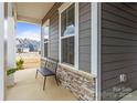 Welcoming front porch with cozy seating area and a view of the neighborhood at 197 Tetcott St, Mooresville, NC 28115