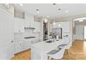 Bright and airy kitchen with white cabinetry and quartz countertops at 197 Tetcott St, Mooresville, NC 28115