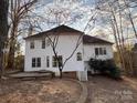 Spacious backyard featuring white siding home with a patio and a well-manicured lawn at 2520 Barrington Ct, Rock Hill, SC 29732