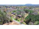 A beautiful home with a large lot surrounded by mature trees and lush greenery, offering privacy at 3407 14Th Sw Ave, Hickory, NC 28602