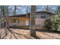 Charming brick home featuring a covered porch, front door decor, and a cozy bench at 3407 14Th Sw Ave, Hickory, NC 28602