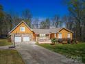 Charming one-story home featuring a two-car garage and stone accents at 605 Allen Way, Indian Trail, NC 28079