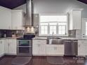 Updated kitchen featuring stainless steel appliances, including double oven and stainless steel sink at 605 Allen Way, Indian Trail, NC 28079
