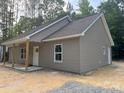 Attractive single-story home with vinyl siding, a covered porch, and white trim at 318 Stanback St, Mount Gilead, NC 27306