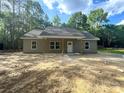 Inviting single-story home featuring a covered front porch and simple landscaping at 318 Stanback St, Mount Gilead, NC 27306
