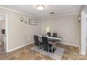 Cozy dining area with a black table, stylish chairs, and view into the adjacent kitchen at 515 Burlington St, Wadesboro, NC 28170