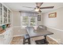Breakfast nook with adjacent counter seating, wood-look floors, and ample natural light at 515 Burlington St, Wadesboro, NC 28170