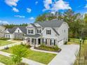 Charming home with stone accents, attached two car garage, and well-manicured lawn at 121 Pine Eagle Dr, Rock Hill, SC 29732