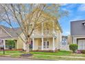 Charming house with double porches and manicured front lawn at 16606 Spruell St, Huntersville, NC 28078
