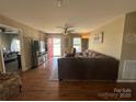 Cozy living room with hardwood floors and an inviting red front door at 52 Restful Ln, Hickory, NC 28601