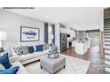 Cozy living room with comfortable seating, stylish decor, and open to kitchen at 6029 Fonsac Ln # 2008C, Charlotte, NC 28217
