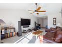 Spacious living room with vaulted ceilings, a ceiling fan, and a comfortable leather sofa at 611 Chase Brook Dr, Rock Hill, SC 29732