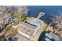 Aerial view of the waterfront property with a private dock and ample parking space at 938 Pinehaven Dr, New London, NC 28127
