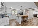 Modern kitchen featuring white cabinets, a center island, and a sliding barn door at 119 Old Hearth Rd, Clover, SC 29710