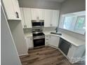 Modern kitchen features stainless steel appliances, sleek white cabinets, and quartz countertops at 144 Walnut St, Chester, SC 29706