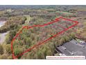 Aerial view of wooded property with approximate property lines overlaid in red at 2018 Fox Creek Trl, Lincolnton, NC 28092