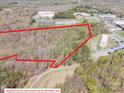 Aerial view of wooded property with approximate property lines overlaid in red at 2018 Fox Creek Trl, Lincolnton, NC 28092