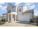 Beautiful two-story home with a side entry garage and a covered front porch at 2105 Moss Bluff Dr, Mint Hill, NC 28227