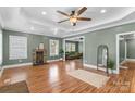 Spacious living room featuring hardwood floors, a stone fireplace, and ample natural light at 306 7Th Sw St, Hickory, NC 28602