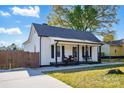 Charming single-story home with a welcoming front porch, white siding, and a well-maintained lawn at 48 Mandalay Sw Pl, Concord, NC 28027