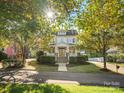 Beautiful two-story home with a welcoming front porch framed by lush trees at 4912 Kenbury Ct, Fort Mill, SC 29708