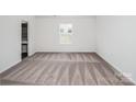 Neutral bedroom with plush carpet and a bright window at 502 Maddox Dr, Shelby, NC 28152