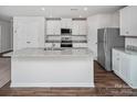 Bright kitchen with stainless steel appliances, granite countertops, and a center island at 502 Maddox Dr, Shelby, NC 28152