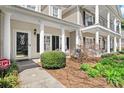Charming home exterior featuring a well-manicured front yard and welcoming porch with classic white columns at 71 40Th Avenue Ne Dr # 7, Hickory, NC 28601