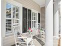 Inviting front porch with rocking chairs, perfect for enjoying a relaxing afternoon at 71 40Th Avenue Ne Dr # 7, Hickory, NC 28601