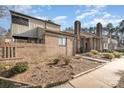 Side view of a brick townhome showcasing well-maintained landscaping and architectural details at 8033 Charter Oak Ln, Charlotte, NC 28226
