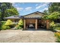 Inviting brick home featuring a cozy front porch, perfect for relaxing and enjoying the outdoors at 9500 Windygap Rd, Charlotte, NC 28278