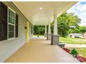 Spacious covered front porch featuring stylish columns and plenty of room for outdoor seating at 1022 Parker St, Monroe, NC 28112