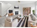 Bright living room with fireplace, sofa, and stylish decor for a cozy atmosphere at 10827 Azure Valley Pl, Charlotte, NC 28269