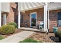 Welcoming front porch of this charming townhouse featuring a cozy seating area, perfect for relaxing at 1100 22Nd Ne St # 502, Hickory, NC 28601