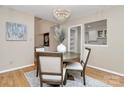 Charming dining area features hardwood floors, modern lighting, and a view to the kitchen at 201 Riverview Ter, Lake Wylie, SC 29710
