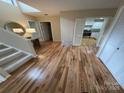 Entryway with hardwood floors, coat closet, bright natural light, and kitchen view at 201 Riverview Ter, Lake Wylie, SC 29710