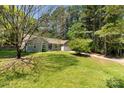 Beautiful home nestled on a spacious lot with mature trees and lush greenery, offering privacy and tranquility at 2014 Cardinal Loop, Stanley, NC 28164