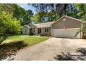 Inviting home with a well-manicured lawn, attached garage and a welcoming front entrance, adding curb appeal at 2014 Cardinal Loop, Stanley, NC 28164