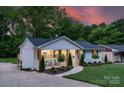 Stylish home with a front porch, landscaping and a curved walkway leading to the entrance at 215 Wyanoke Ave, Charlotte, NC 28205