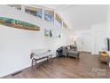 Inviting living room featuring an A-frame ceiling, lots of natural light and a comfortable seating area at 2403 Earley Cir, Kannapolis, NC 28083