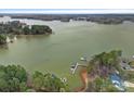 Aerial view of waterfront homes featuring private boat docks on the lake at 2587 Penngate Dr, Sherrills Ford, NC 28673