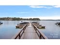 Picturesque view of a private boat dock extending into the tranquil waters of a serene lake setting at 2587 Penngate Dr, Sherrills Ford, NC 28673